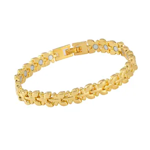 Detailed view of polished gold-finished butterfly links on a feminine magnetic therapy bracelet