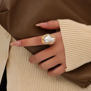 Elegant vintage style irregular gold ring with a large white baroque faux pearl