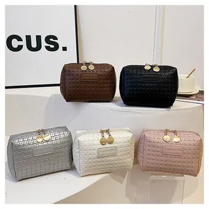Five colors of woven texture square cosmetic bags displayed on white steps.