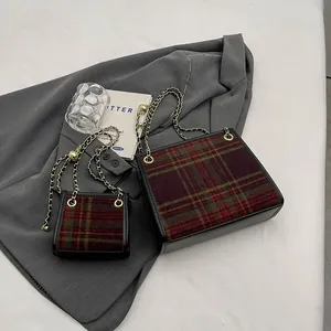 Two stylish plaid tweed crossbody bags in large and mini sizes with elegant gold chain straps