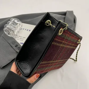Close-up top view showing the spacious interior of the woolen plaid tote bag with chain strap