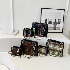Collection of stylish plaid woolen square bags in various sizes with elegant gold chain straps