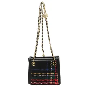 Detailed front view of stylish plaid woolen small square bag with golden chain strap