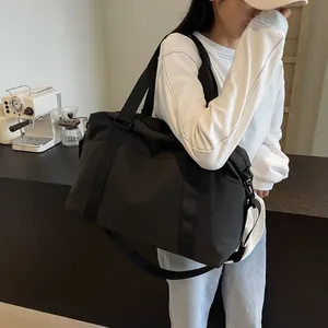 Large-capacity black stylish travel duffel bag featuring dry-wet separation design