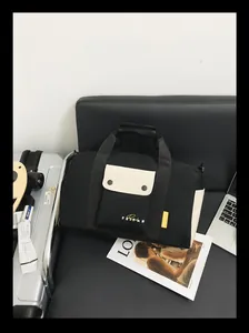 Sac de voyage noir et crème haut de gamme pour le sport et les week-ends en scène