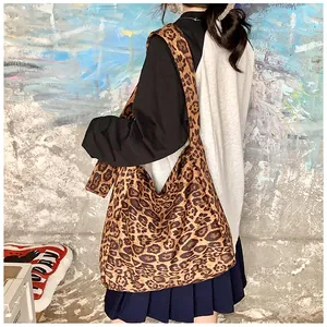 Leopard print cotton tote bag with a spacious shoulder design for a retro casual look.