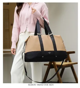 Stylish large capacity travel duffel bag with adjustable shoulder strap held by model