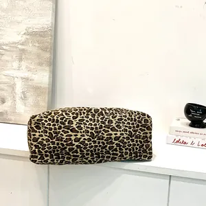Close-up of a leopard print cotton tote bag showing the texture and pattern.
