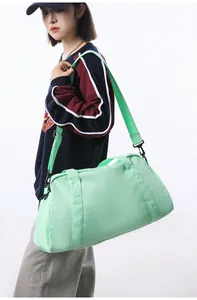 Large mint green sports duffel bag for gym or short travel, lightweight nylon material.