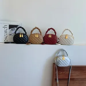 Trendy quilted handbags in five colors with ruffled handles and gold lock charms