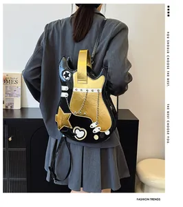 Detail of creative guitar-shaped backpack with star and heart patterns in black and gold