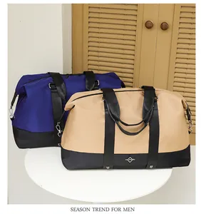 High-quality detail of blue and beige large travel bags with handles on a white table