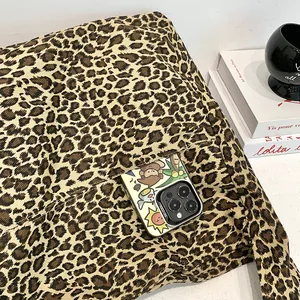 Close-up detail of leopard print cotton tote bag featuring a functional pocket