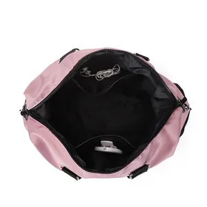 Spacious pink travel bag interior view showing large storage compartment and pockets