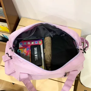 Spacious lavender travel gym bag showing interior storage for clothes and gadgets