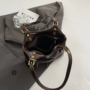 Interior view of dark brown retro faux leather tote bag with gold metal hardware