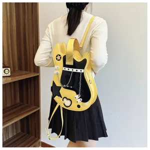 Detail view showing a creative yellow and black guitar-shaped backpack on a model's back