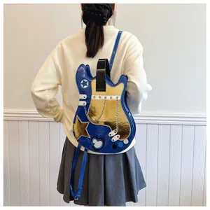 Creative blue and gold guitar-shaped backpack displayed on a model in a minimal setting.
