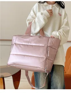 Large pink quilted travel tote bag for women, perfect for gym and weekend trips.