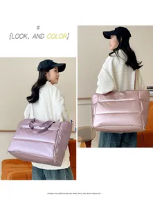 Large capacity quilted metallic travel bag in lavender and rose gold worn by model