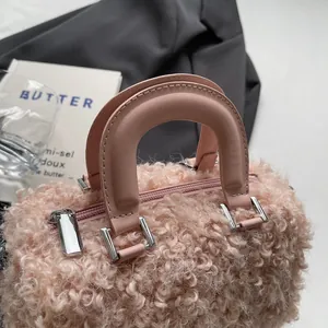 Detailed view of soft pink plush texture and silver hardware on retro box handbag