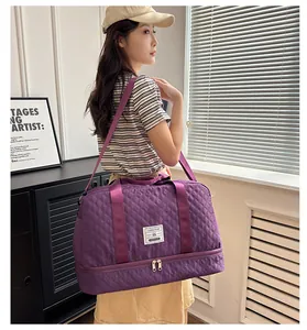 Asian model carrying a purple quilted travel bag with dry wet separation compartment