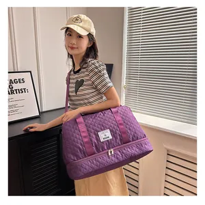 Purple quilted travel bag with dry-wet separation and bottom shoe compartment detail