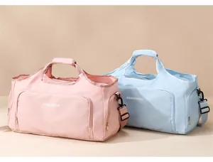Large capacity travel duffel bags in pink and light blue for gym or weekend trips.