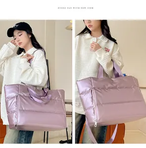 Details of a large lavender metallic travel bag held by a model from two angles