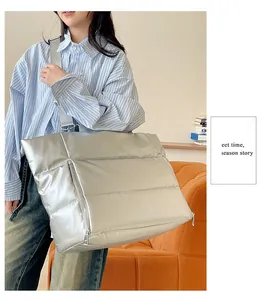 Large silver puffer travel tote bag for women ideal for gym fitness and weekend trips