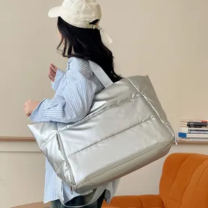 Large silver metallic puffer travel tote bag for women's gym and weekend trips lifestyle