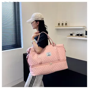 Detailed view of pink quilted fitness bag with shoe compartment in a modern cafe setting