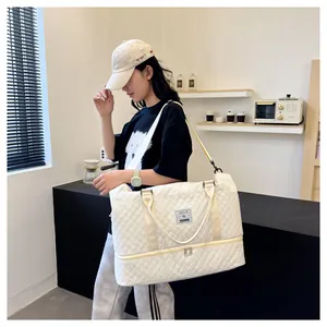 White quilted travel bag with shoe compartment shown in a modern lifestyle setting
