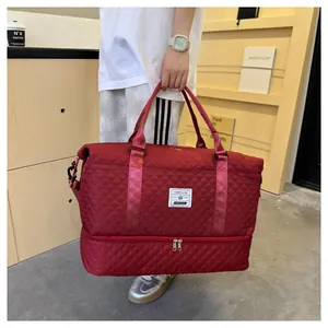 Large burgundy quilted travel bag with independent shoe compartment and wet dry separation