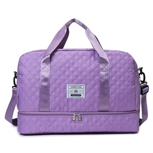 Close-up front view highlighting the quilted texture and structure of this purple travel bag
