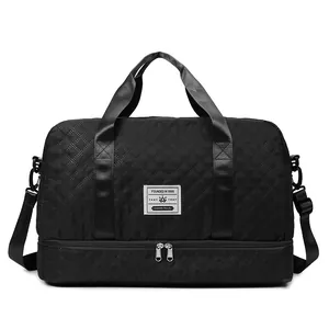 Close-up of black quilted travel bag featuring dry-wet separation and dual zippers