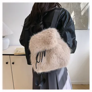 Back view of a stylish beige faux fur backpack on a model in a casual setting.
