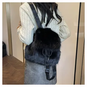 Close-up of a stylish black faux fur backpack worn by a model in a casual setting.