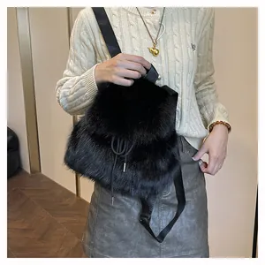 Black plush faux fur bucket backpack shown on a model with stylish casual outfit