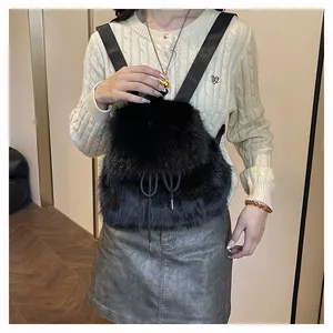 Fashionable black faux fur backpack for women, shown in a lifestyle detail shot