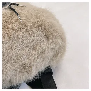 Close-up of soft beige plush fur texture on travel backpack with black drawstring