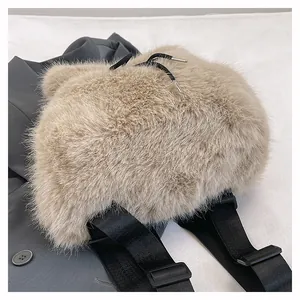 Close-up of soft beige furry backpack with adjustable black shoulder straps