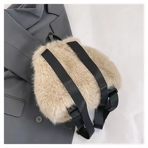 Back view of cute beige faux fur backpack with adjustable black straps