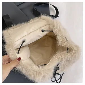 Detailed interior view of a plush faux fur bucket backpack with drawstring closure