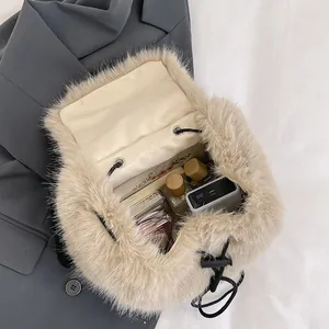 Large capacity beige faux fur bucket bag with drawstring closure and soft texture
