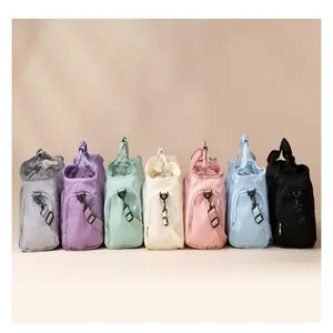 Close-up detail of large capacity travel duffel bags shown in seven different colors