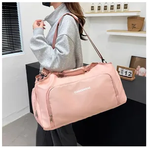 Pink large capacity travel duffle bag for fitness and business trips, model view