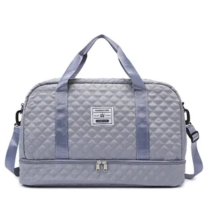 Close-up of the quilted texture and separate bottom compartment on this travel bag.