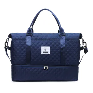 Navy blue quilted fitness duffel bag featuring a separate bottom storage shoe compartment