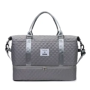 Grey quilted travel bag with independent shoe compartment for gym and yoga fitness